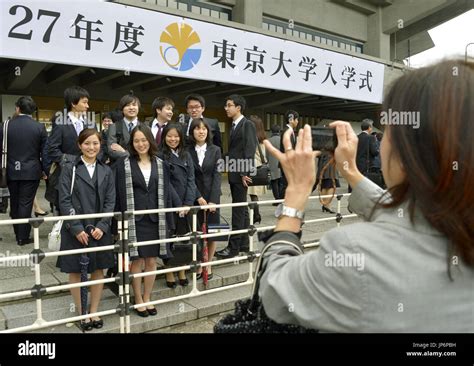 New students of the University of Tokyo pose for a photo ahead of the ...