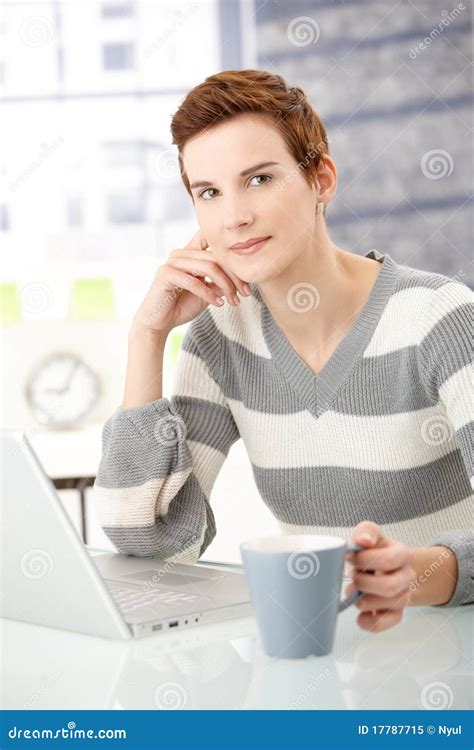 Young Woman with Coffee Mug and Laptop Stock Image - Image of desk, contact: 17787715