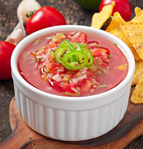 Free Photo | Mexican nacho chips and salsa dip in bowl on wooden