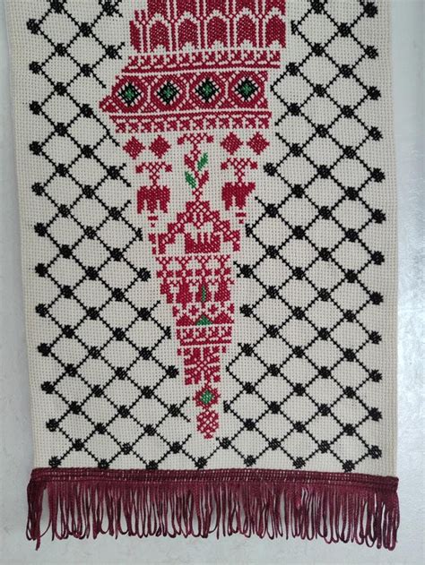 Handmade Palestine map embroidery with background of Keffiyeh