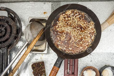 Cooking Miki Noodles on a Gas Burner. Ingredients for Pancit Cabagan, a Dish Originating from ...