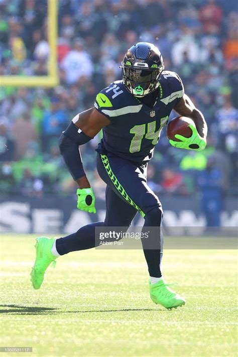 DK Metcalf of the Seattle Seahawks runs with the ball against the ...