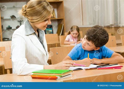 Teacher and pupil stock photo. Image of classroom, female - 5923192