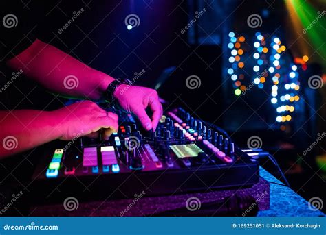 Male DJ Mixes Electronic Music with His Hands on a Professional Music ...