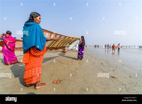 Women are drying her saris on the beach of Ganga Sagar, celebrating ...