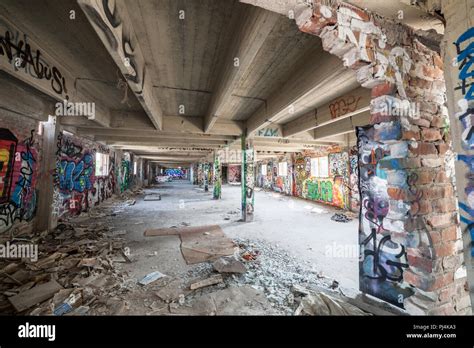 Old abandoned factory hall and graffiti Stock Photo - Alamy