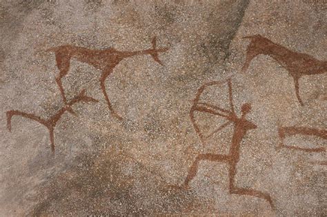 Prehistoric Man Drawing on Cave Walls