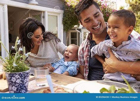 Family at Home Eating Outdoor Meal in Garden Together Stock Photo - Image of caucasian, girl ...