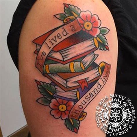 a woman with a tattoo on her arm has a stack of books and flowers around it