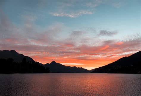 Free photo: Body of Water Near Silhouette of Mountain Under White Clouds during Sunset ...