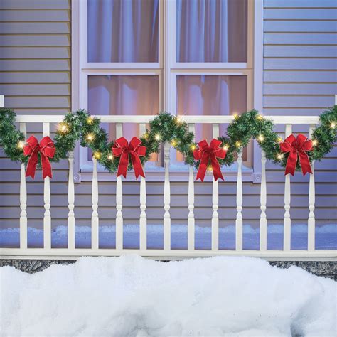 9ft Lighted Winter Garland with Bows and Pine Accents, Indoor or Outdoor Christmas Decor ...