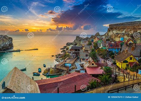 Il-Mellieha, Malta - Sunset at the Famous Popeye Village at Anchor Bay ...