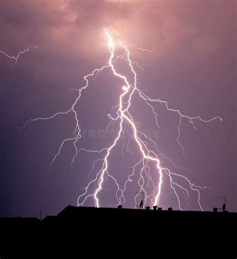 Silhouettes of Buildings in a Thunderstorm