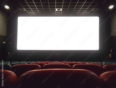 cinema interior of movie theatre with empty red and black seats with copyspace on the screen and ...