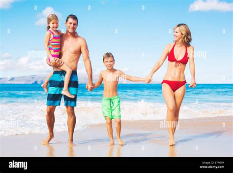 Happy Family on the Beach Stock Photo - Alamy