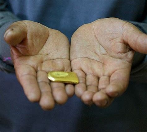 Javiar the talented goldsmith in La Paz showing me a brick of pure gold ...