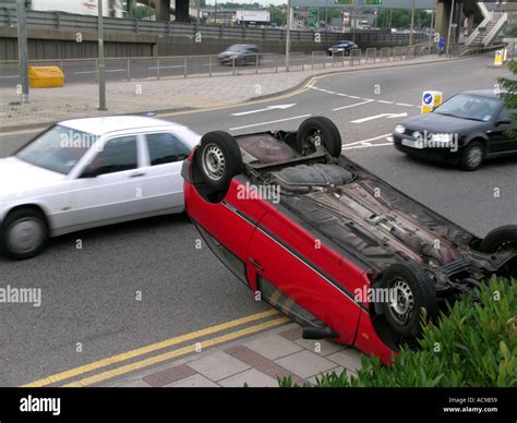 Red car auto automobile crash accident London England UK Occupants nearby unharmed Stock Photo ...