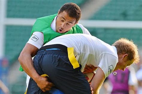 Prince Harry pictured playing rugby at Twickenham Stadium and backs England to win 2015 World ...