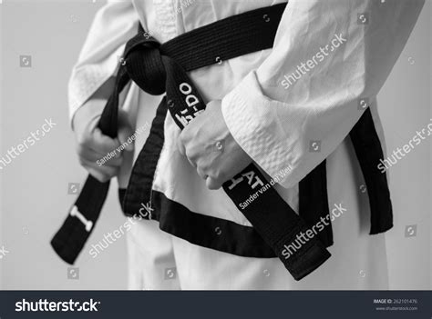 Taekwondo Woman Tying Her Black Belt Stock Photo 262101476 | Shutterstock