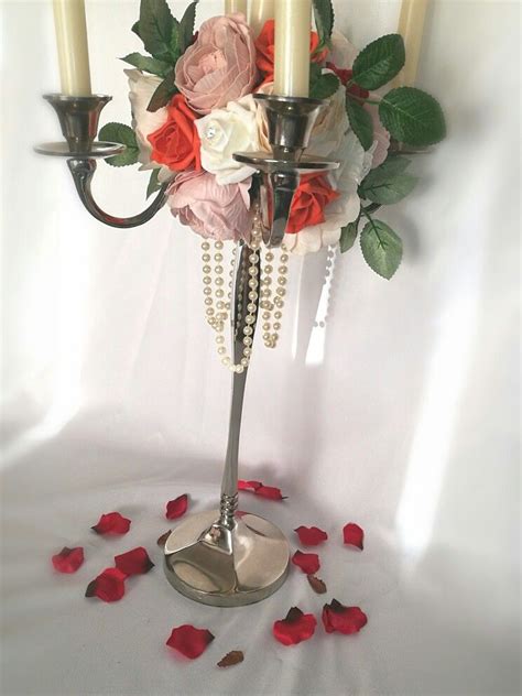 Beautiful floral candelabra! Silver candelabra with pearl droplet, roses & peony! #orange #roses ...