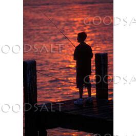 Boy Fishing at Sunset - GoodSalt