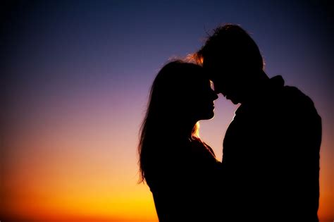 Beach bride and groom celebrate saying I Do during beautiful sunset