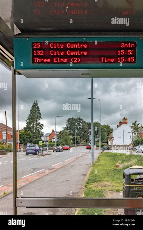 Cardiff, Wales, UK - Bus timetable showing the next buses at a bus stop. Council service cuts ...