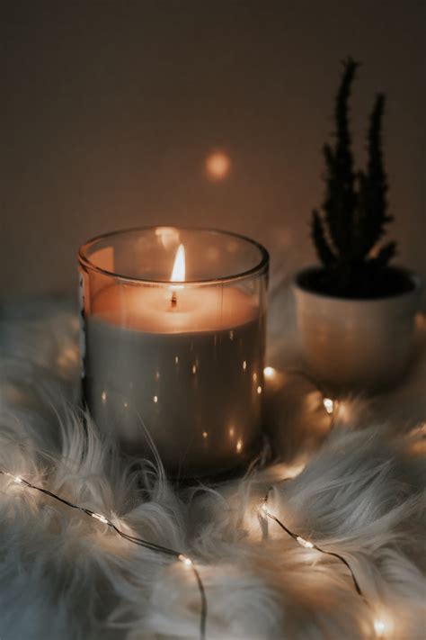 white candle on clear glass holder photo – Free Candle Image on ...