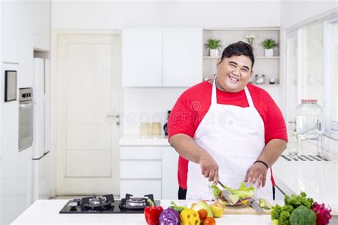 Smiling Fat Man Mixing a Tasty Salad Stock Photo - Image of male ...