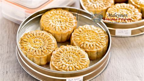 Traditional Baked Mooncakes filled with sesame seed or red bean paste and salted egg yolk. A ...