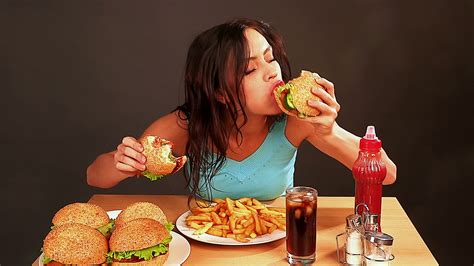 woman eating junk food – Johnson Fitness and Wellness