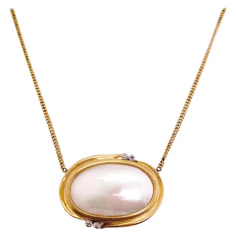 Rhino Diamond Gold Tahiti Pearl Pendant at 1stDibs