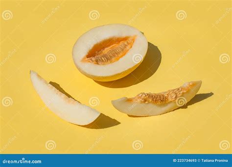 Sunny Sliced Melon with Seeds on Yellow Background Stock Image - Image ...