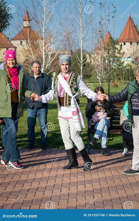 People Dance Moldovan Dance. Men and Women in National Costumes Dance ...