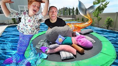 Mermaid PiLLOW FiGHT!! Adley vs Dad magic trampoline battle with a Giant LoveSac in the Backyard ...