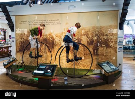 Penny farthing bicycle race display in the musuem of Much Wenlock, Shropshire, England Stock ...