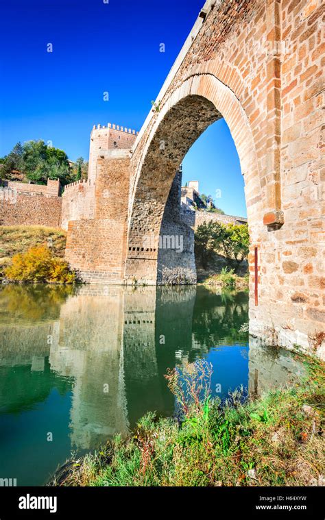 Toledo, Spain. Alcantara Bridge ( Puente de Alcantara ) is an arch ...