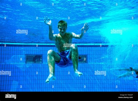 boy diving in a swimming pool Stock Photo - Alamy