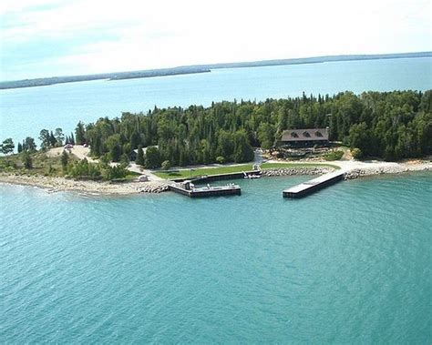 For $1.25M, a private Lake Huron island with cabin, trails, a beach and a yacht-sized harbor ...