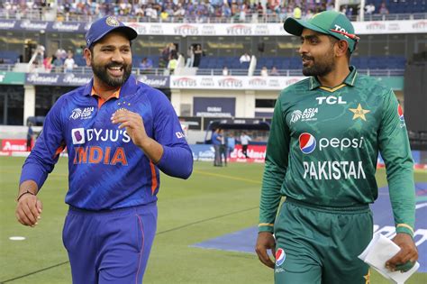 Babar Azam and Rohit Sharma walk out for the toss | ESPNcricinfo.com