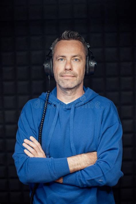 Portrait of Male Radio Host with Headphones with Arms Crossed Standing ...