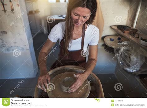 Artisan Shaping Clay on a Pottery Wheel in Her Workshop Stock Photo - Image of copy ...