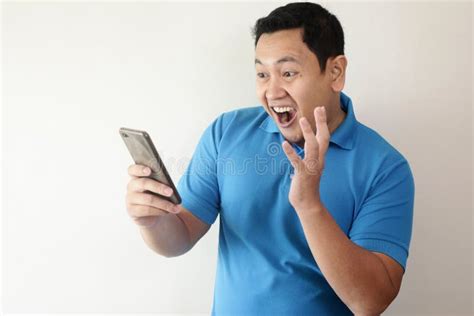 Shocked Happy Man Looking at Smart Phone Stock Photo - Image of ...