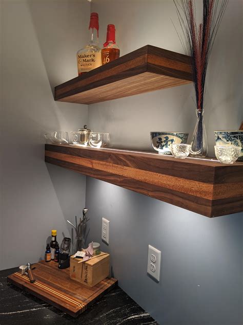 Two tone floating shelves. Made with walnut and African mahogany. Inlay LED strip lighting for ...