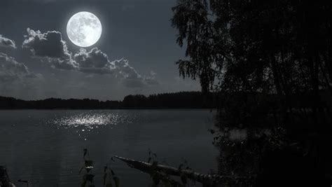 Moon Over The Lake At Night. Video Footage Of Bright Moon Over A Lake At Night. Stock Footage ...