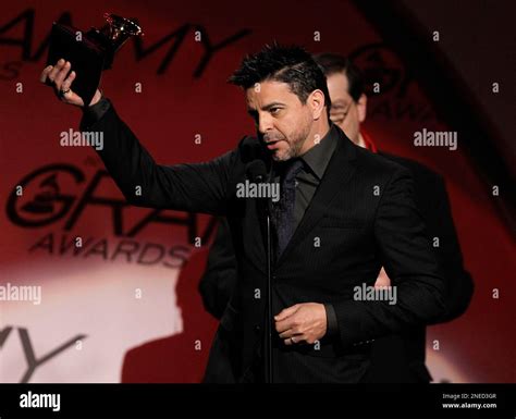 Luis Enrique accepts the award for best tropical latin album for ...