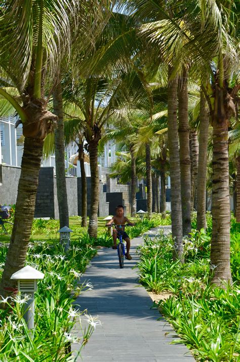 Shaded beach trail at Hotel Premier Village Danang Resort By SALA Design Group Splash Park ...