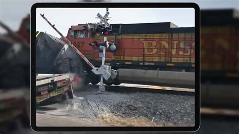 Video: Train Crashes, Derails After Hitting Semi-Truck Stuck On Crossing