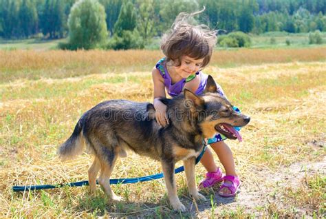 Little Girl Playing With Dog Royalty Free Stock Photos - Image: 29128298