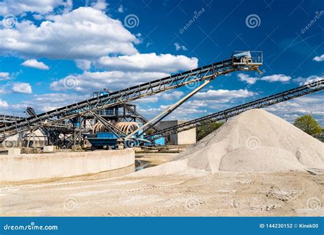 Conveyor Over Heaps of Gravel on Blue Sky at an Industrial Cement Plant. Stock Photo - Image of ...